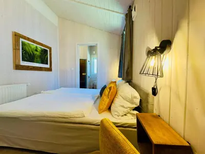 Ein Bett oder Betten in einem Zimmer der Unterkunft Ferienhaus Trollblume - Sankt Andreasberg im Harz