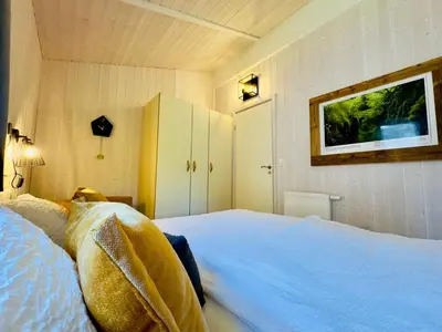 Ein Bett oder Betten in einem Zimmer der Unterkunft Ferienhaus Trollblume - Sankt Andreasberg im Harz