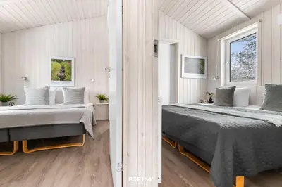 Ein Bett oder Betten in einem Zimmer der Unterkunft Ferienhaus Waldpalast - Sankt Andreasberg im Harz