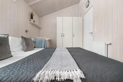 Ein Bett oder Betten in einem Zimmer der Unterkunft Ferienhaus Waldpalast - Sankt Andreasberg im Harz
