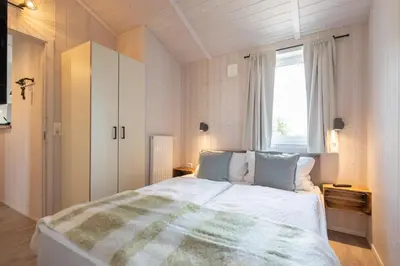 Ein Bett oder Betten in einem Zimmer der Unterkunft Ferienhaus Silberhütte - Sankt Andreasberg im Harz