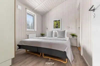 Ein Bett oder Betten in einem Zimmer der Unterkunft Ferienhaus GLÜCK AUF - Sankt Andreasberg im Harz