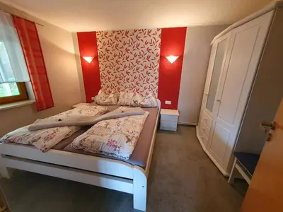 Ein Bett oder Betten in einem Zimmer der Unterkunft Nelius - Ferienhaus 2
