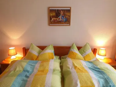Ein Bett oder Betten in einem Zimmer der Unterkunft Nelius - Ferienhaus 1