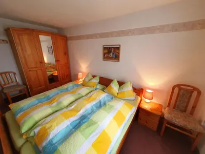 Ein Bett oder Betten in einem Zimmer der Unterkunft Nelius - Ferienhaus 1