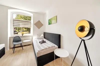 Ein Bett oder Betten in einem Zimmer der Unterkunft Schöne FeWo im EG mit Hof, für 4 Personen