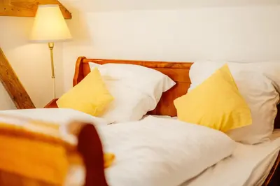 Ein Bett oder Betten in einem Zimmer der Unterkunft Ferienhaus- Gruppenunterkunft mit Festsaal, Frühstück, Halbpension extra buchbar