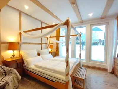 Ein Bett oder Betten in einem Zimmer der Unterkunft Ferienhaus- Gruppenunterkunft mit Festsaal, Frühstück, Halbpension extra buchbar