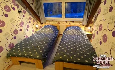 Ein Bett oder Betten in einem Zimmer der Unterkunft Arode Alte Schmiedemühle