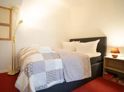 Ein Bett oder Betten in einem Zimmer der Unterkunft Harzliebe Vier Jahreszeiten