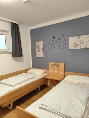 Ein Bett oder Betten in einem Zimmer der Unterkunft Apartment Morgengruß - Pool & Sauna
