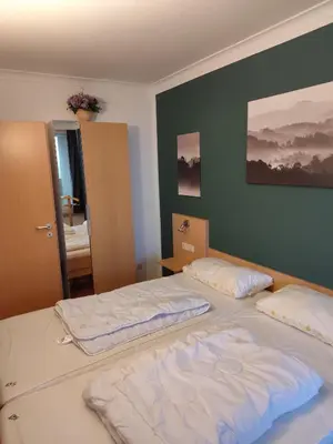 Ein Bett oder Betten in einem Zimmer der Unterkunft Apartment Morgengruß - Pool & Sauna