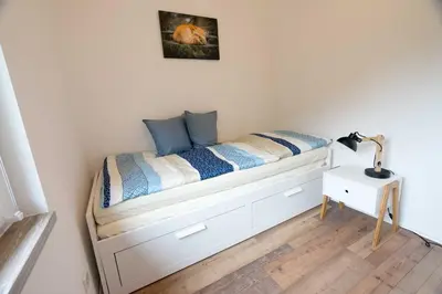 Ein Bett oder Betten in einem Zimmer der Unterkunft Ferienhaus Harzblüte