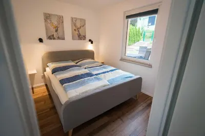 Ein Bett oder Betten in einem Zimmer der Unterkunft Ferienhaus Harzblüte
