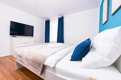 Ein Bett oder Betten in einem Zimmer der Unterkunft Ferienwohnung Stadtblick - Modernes Wohnen auf 2 Etagen