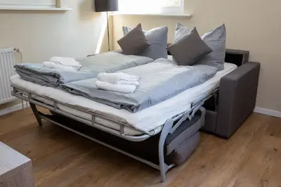 Ein Bett oder Betten in einem Zimmer der Unterkunft Lieblingsquartier Wohnung 12