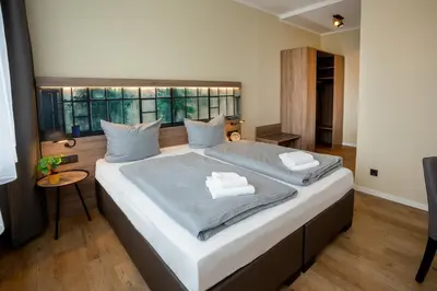 Ein Bett oder Betten in einem Zimmer der Unterkunft Lieblingsquartier familiy Suite 2-3