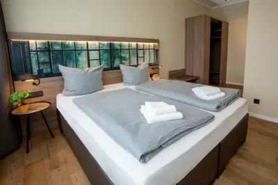 Ein Bett oder Betten in einem Zimmer der Unterkunft Lieblingsquartier familiy Suite 2-3
