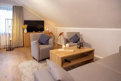 Ein Sitzbereich in der Unterkunft Chalet Bergzeit 3