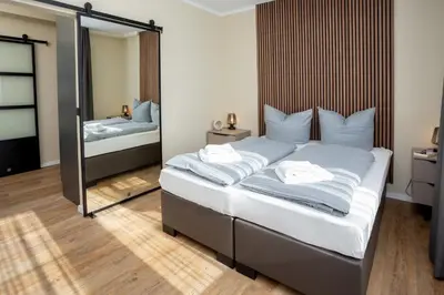 Ein Bett oder Betten in einem Zimmer der Unterkunft LQ familiy Suite 4 5