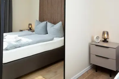 Ein Bett oder Betten in einem Zimmer der Unterkunft LQ familiy Suite 4 5