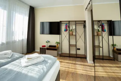 Ein Bett oder Betten in einem Zimmer der Unterkunft LQ familiy Suite 4 5