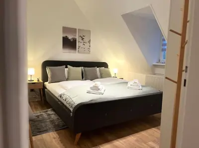 Ein Bett oder Betten in einem Zimmer der Unterkunft Moderne FeWo in Goslars Altstadt