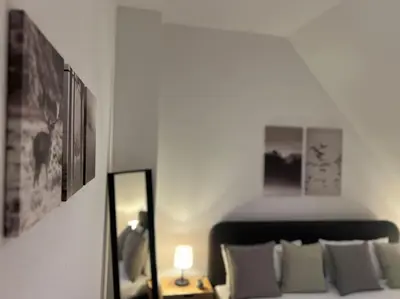 Ein Bett oder Betten in einem Zimmer der Unterkunft Moderne FeWo in Goslars Altstadt