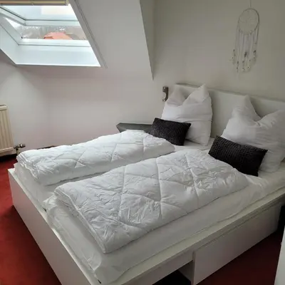 Ein Bett oder Betten in einem Zimmer der Unterkunft Ferienwohnung Gipfelglück mit Fernblick und Strandkorb