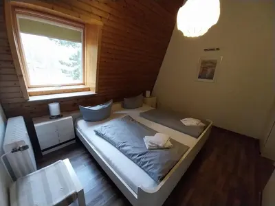 Ein Bett oder Betten in einem Zimmer der Unterkunft Suite Rübezahl
