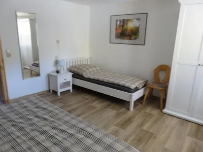 Ein Bett oder Betten in einem Zimmer der Unterkunft Ferienhaus Diana in Thale OT Altenbrak