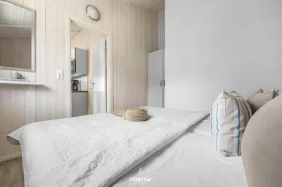 Ein Bett oder Betten in einem Zimmer der Unterkunft Ferienhaus Fuchsbau - St Andreasberg im Harz