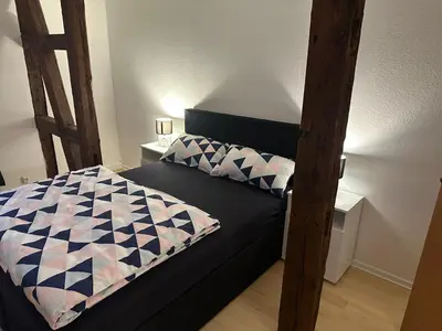 Ein Bett oder Betten in einem Zimmer der Unterkunft Ferienwohnung 1 Berliner Platz