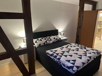 Ein Bett oder Betten in einem Zimmer der Unterkunft Ferienwohnung 1 Berliner Platz