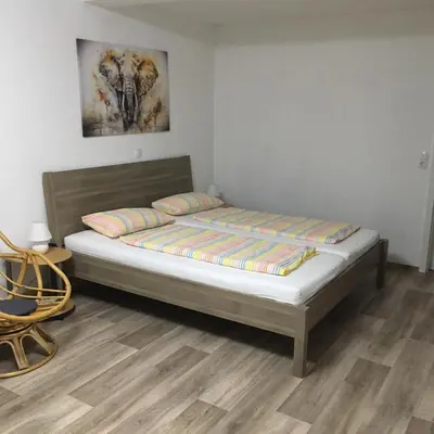 Ein Bett oder Betten in einem Zimmer der Unterkunft Gästezimmer Fischer