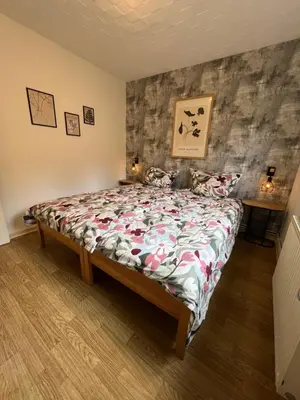 Ein Bett oder Betten in einem Zimmer der Unterkunft Ferienhaus Denise Harz