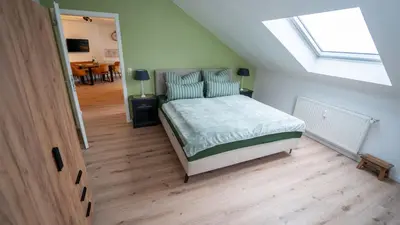 Ein Bett oder Betten in einem Zimmer der Unterkunft Ferienapartment am Rosenberg