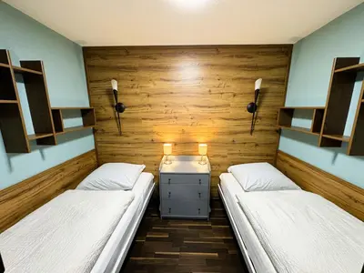 Ein Bett oder Betten in einem Zimmer der Unterkunft FeWo Traumblick im Ferienpark Altenau
