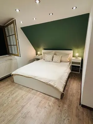 Ein Bett oder Betten in einem Zimmer der Unterkunft Ferienhaus am Bückeberg mit Brockenblick