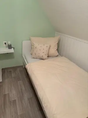 Ein Bett oder Betten in einem Zimmer der Unterkunft Ferienhaus am Bückeberg mit Brockenblick