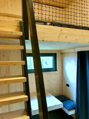 Ein Bett oder Betten in einem Zimmer der Unterkunft Treehouse In The Harz National Park