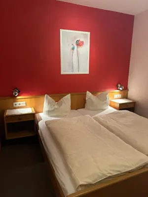 Ein Bett oder Betten in einem Zimmer der Unterkunft Hotel Berliner Hof