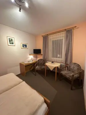 Ein Bett oder Betten in einem Zimmer der Unterkunft Hotel Berliner Hof