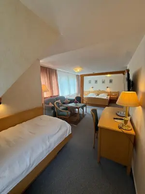 Ein Bett oder Betten in einem Zimmer der Unterkunft Hotel Berliner Hof