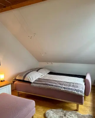 Ein Bett oder Betten in einem Zimmer der Unterkunft Ferienwohnung Gipfelblick