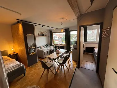 Ein Bett oder Betten in einem Zimmer der Unterkunft Brauni City Apartment