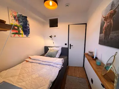 Ein Bett oder Betten in einem Zimmer der Unterkunft Brauni City Apartment
