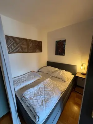 Ein Bett oder Betten in einem Zimmer der Unterkunft Brauni City Apartment