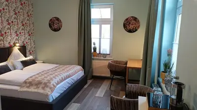 Ein Bett oder Betten in einem Zimmer der Unterkunft Hotel Bodethal