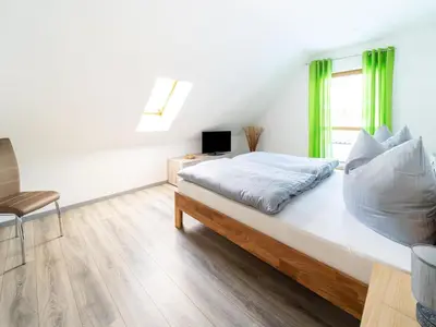Ein Bett oder Betten in einem Zimmer der Unterkunft Forest Villa with Sauna